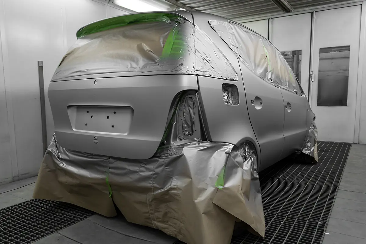 Vehicle prepared for professional painting and color matching services.